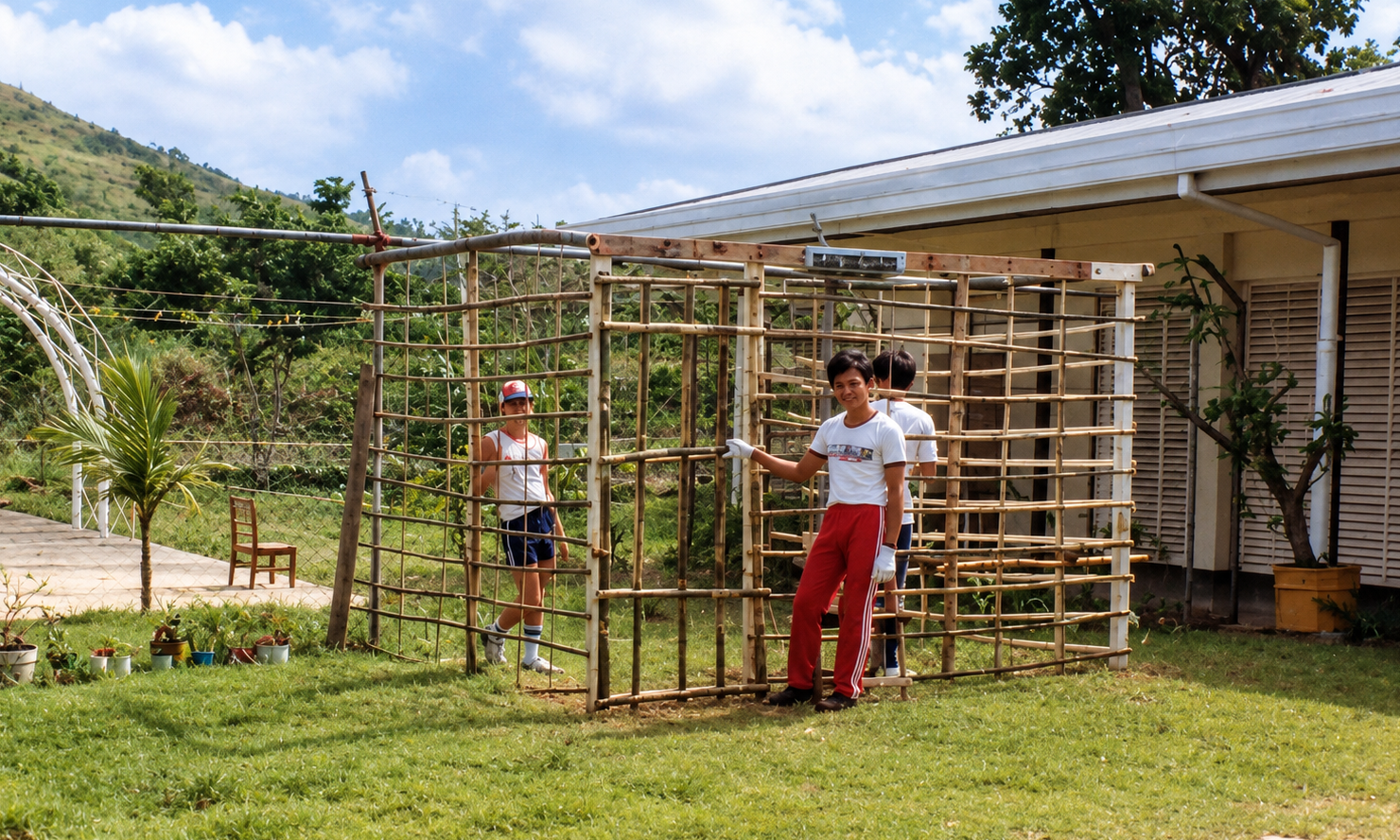 Young people beside a bamboo mock jail at a school open house.