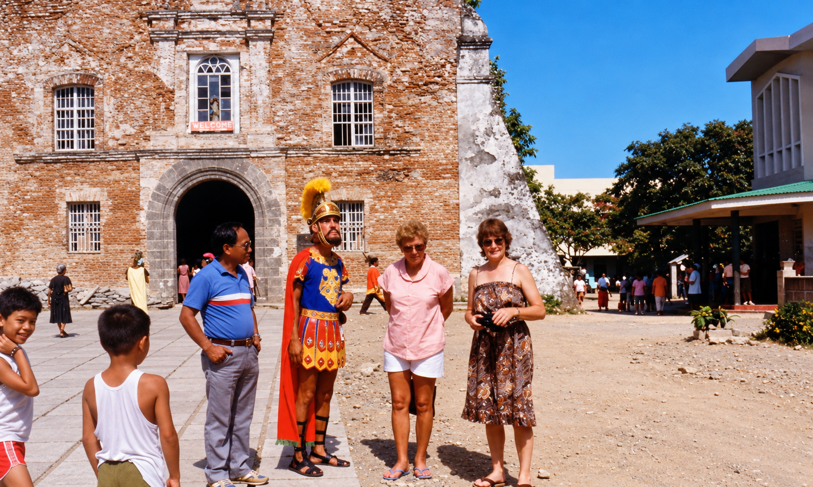 A group standing with a costumed Roman soldier outside a brick church.